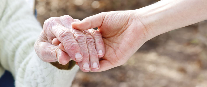 Close up woman holder elderly woman's hand