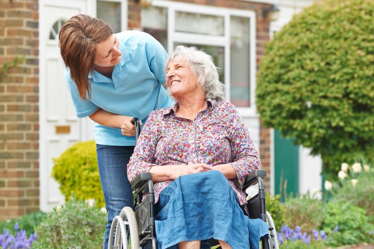 Aged care and home care sunshine coast elderly woman in a wheelchair looking up at nurse